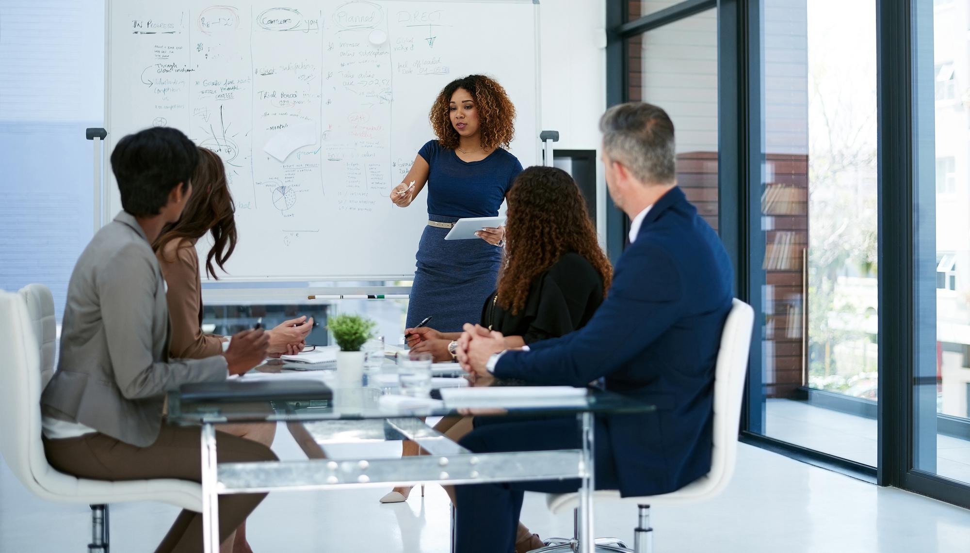 Analysts reviewing workflow optimization opportunities within client manufacturing facility